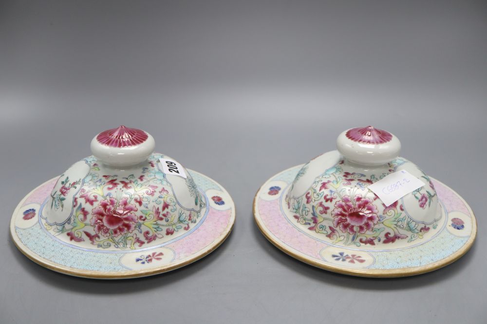 A pair of late 19th century Chinese famille rose covers, diameter 20.5cm